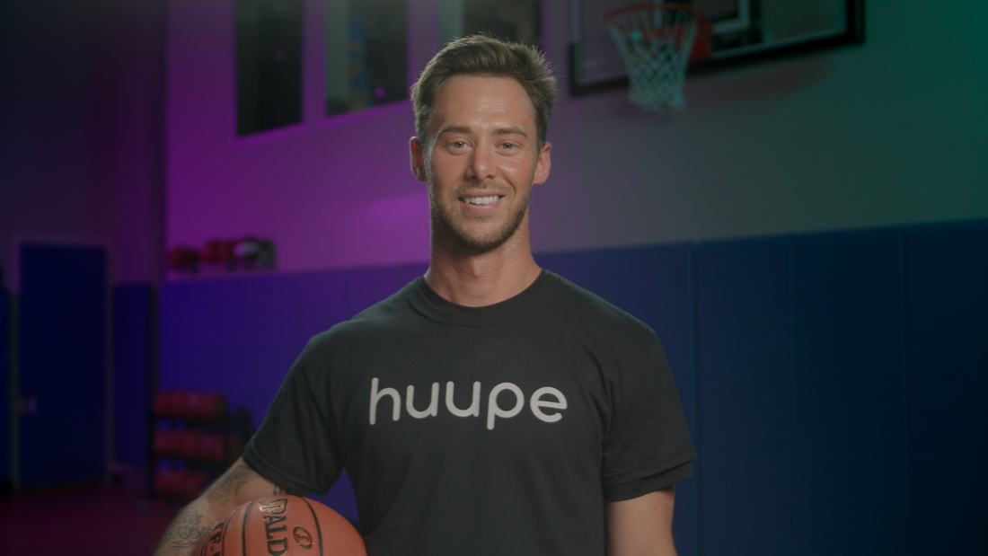 Trainer Holding a Basketball