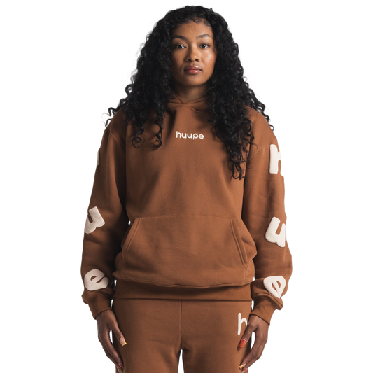 woman wearing brown huupe sweats