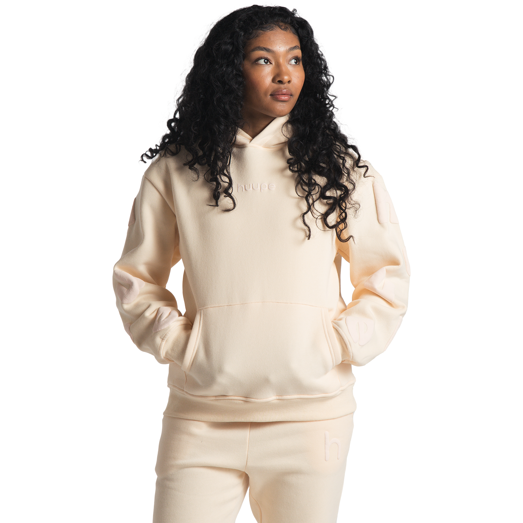 woman wearing cream huupe sweats