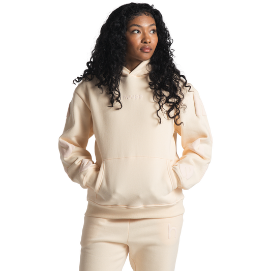 woman wearing cream huupe sweats