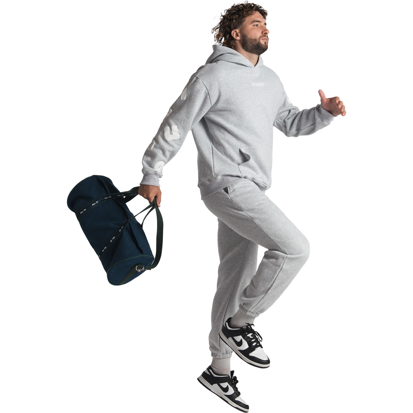 man wearing gray huupe sweats