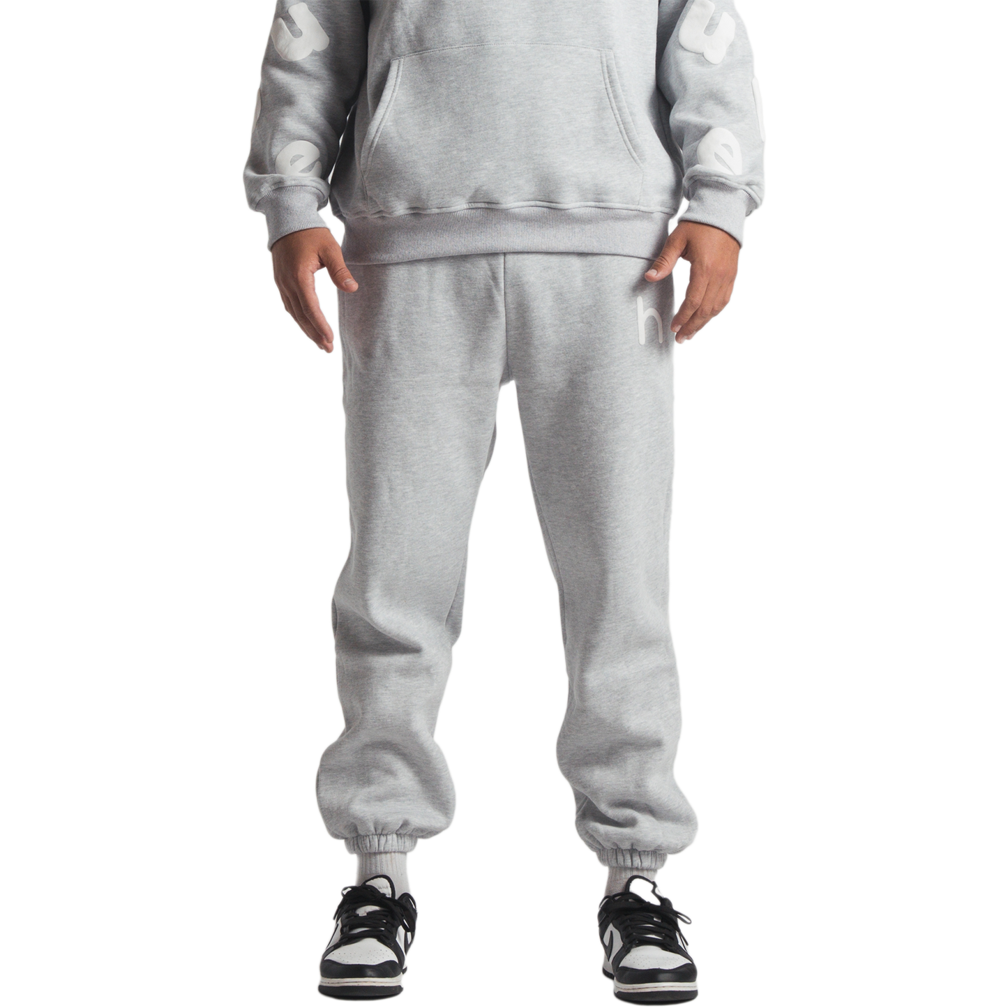 man wearing gray huupe sweats