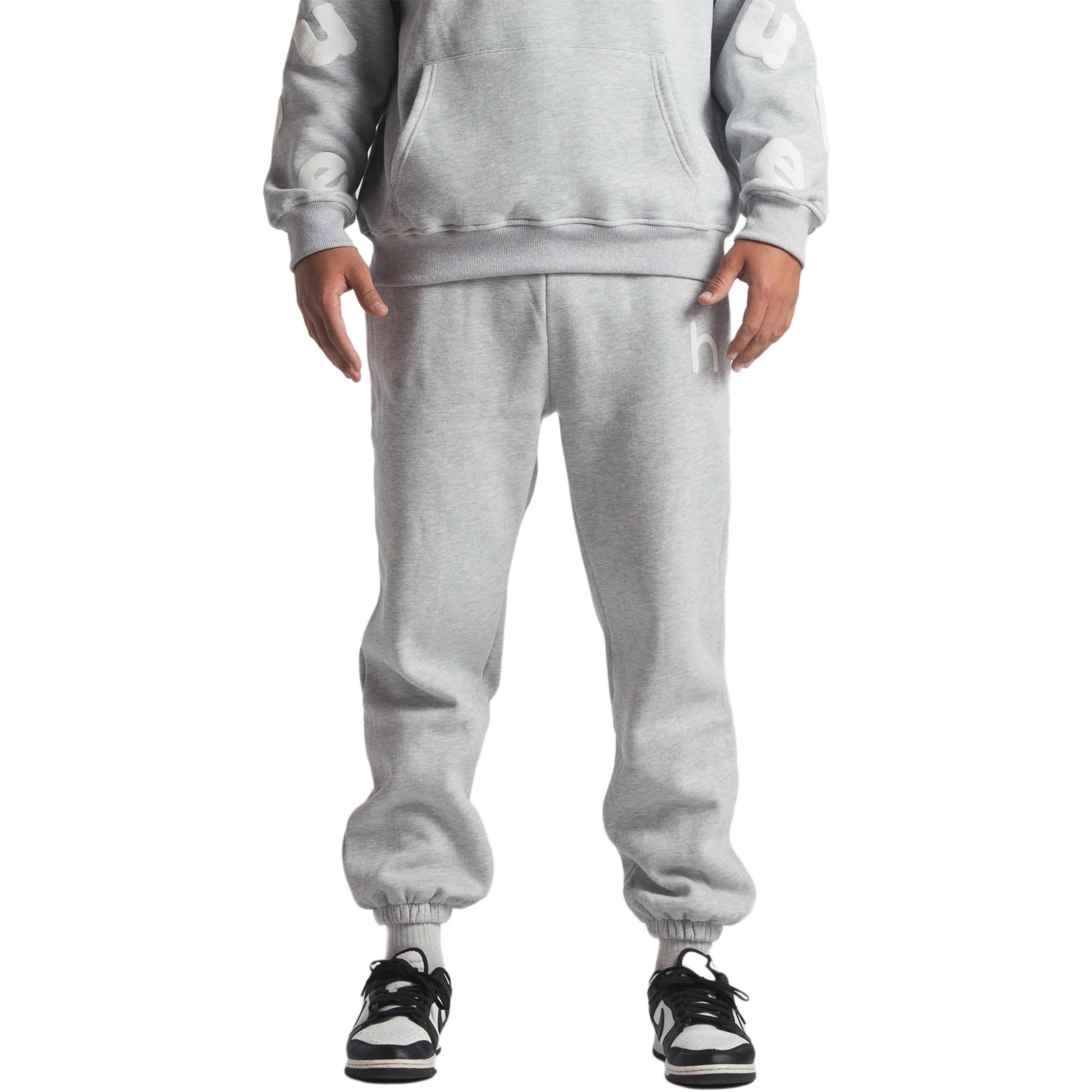 man wearing gray huupe sweats