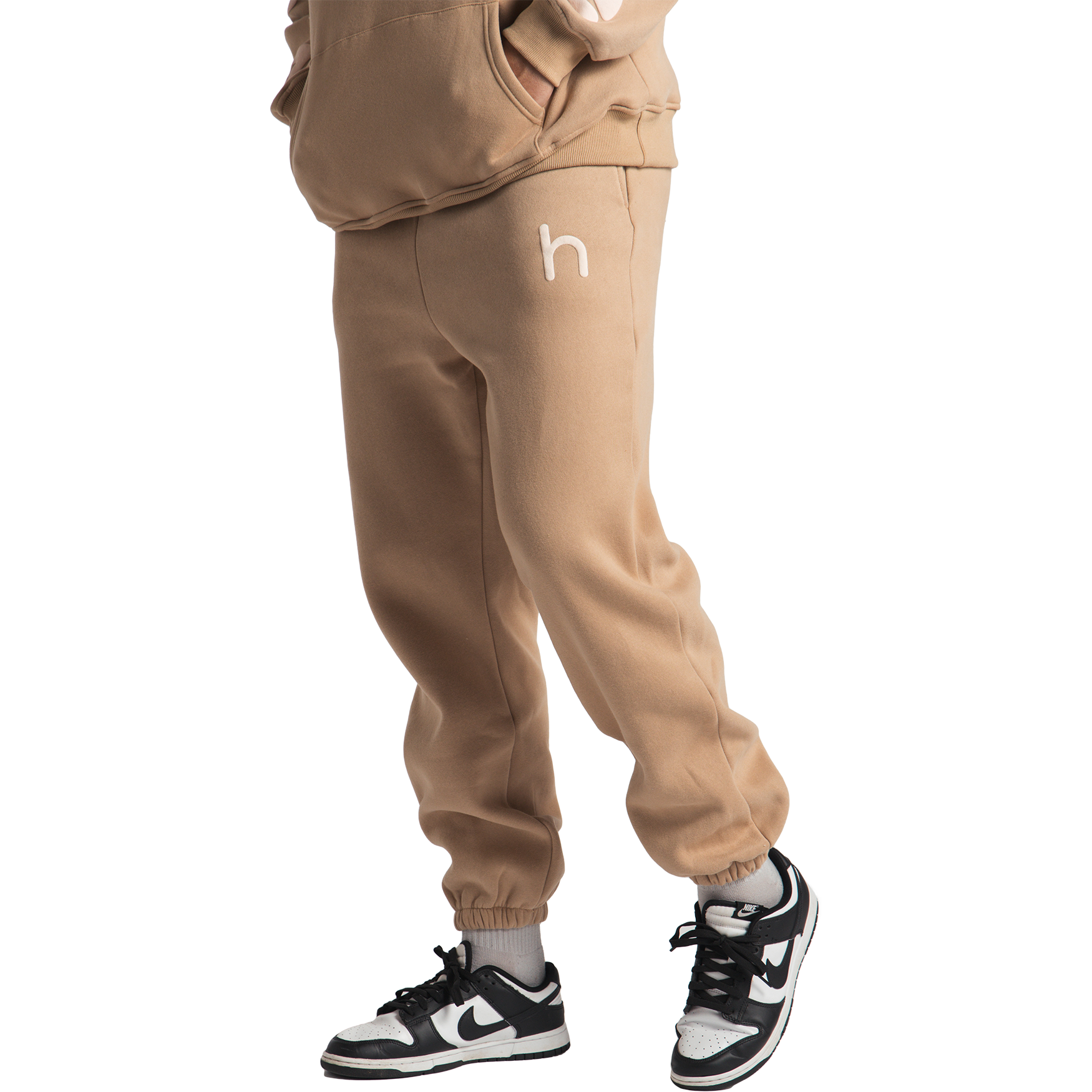 man wearing tan huupe sweats